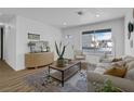 Cozy living room showcasing hardwood floors and tasteful decor at 3883 Seedling Way, Las Vegas, NV 89115