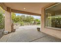 Covered patio with built-in grill and view of backyard at 5124 Pensier St, Las Vegas, NV 89135