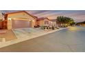 Attractive home with a 2-car garage and desert landscaping at 10290 Hawks Wing St, Las Vegas, NV 89178