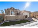 One-story home with a charming facade and landscaped front yard at 10499 Skye Paseo Ave, Las Vegas, NV 89166