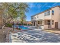 Wonderful backyard features a sparkling pool and outdoor cooking space perfect for entertaining at 11276 Accademia Ct, Las Vegas, NV 89141