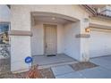 Inviting front entrance with a covered porch and well-maintained landscaping at 11276 Accademia Ct, Las Vegas, NV 89141