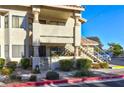 Condo exterior featuring a walkway, stairs, and landscaping at 1205 Sulphur Springs Ln # 101, Las Vegas, NV 89128