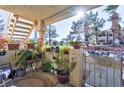 Charming condo patio with lush potted plants and gate at 1205 Sulphur Springs Ln # 101, Las Vegas, NV 89128