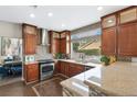 Modern kitchen with stainless steel appliances and granite countertops at 1713 Sequoia Dr, Henderson, NV 89014