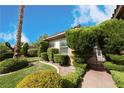 Landscaped front yard with mature shrubs and trees at 1788 Amarone Way, Henderson, NV 89012