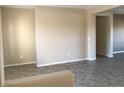 Spacious living room with tile flooring and neutral color palette at 2416 Weaverville Dr, Henderson, NV 89044