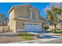 Two-story house with a landscaped yard and attached two-car garage at 2525 Huber Heights Dr, Las Vegas, NV 89128