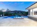 Stunning pool and spa with mountain backdrop at sunset at 2623 Turtle Head Peak Dr, Las Vegas, NV 89135