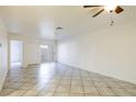 Spacious living area featuring tile floors and access to patio at 3017 Saint George St # B, North Las Vegas, NV 89030