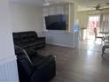 Spacious living room with a large TV and comfortable seating at 307 E Van Wagenen St, Henderson, NV 89015