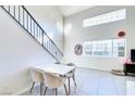 Bright dining area with white table and chairs at 5476 Green Horn St, Las Vegas, NV 89118