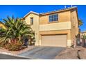 Two-story house with beige exterior, palm tree, attached garage, and driveway at 6228 Wood Stork Ave, Las Vegas, NV 89122