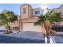 Two-story house with attached garage and palm trees at 6641 Hurkling Stone Ave, Las Vegas, NV 89139