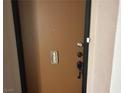 Condo unit entrance with brown door at 730 S Royal Crest Cir # 445, Las Vegas, NV 89169