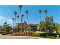 Exterior home view with palm trees, landscaping and blue sky at 7880 Dana Point Ct, Las Vegas, NV 89117