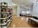 Bright living room with hardwood floors, a fireplace, and ample natural light at 8116 Sedona Sunset Dr, Las Vegas, NV 89128