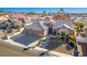 Aerial view of a single-Gathering home with a two-car garage and desert landscaping at 816 Sandsprings St, Henderson, NV 89011