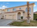 Beautiful two-story home with a three-car garage and manicured lawn at 8529 Copper Knoll Ave, Las Vegas, NV 89129