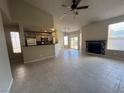 Spacious living area with tile floors and a kitchen view at , Henderson, NV 89014