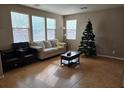 Living room features tile floors and neutral color palette at 10046 Dancing Lasso Ct, Las Vegas, NV 89178