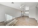 Bright living room featuring new floors, neutral paint, ceiling fan and abundant natural light at 1212 Reynolds Ave, North Las Vegas, NV 89030