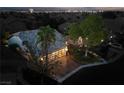 Elevated view of a single-story home with a spacious front yard and driveway at 140 Cora Hills Ct, Las Vegas, NV 89148