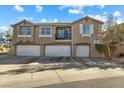 Three-car garage and inviting exterior of a two-story townhome at 20 Red Oak Canyon St # 3, Henderson, NV 89012