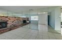 Living room with brick fireplace and mirrored wall at 2108 Kirk Ave, Las Vegas, NV 89101