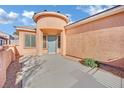 Front entry with gray door and stone accents at 2736 Mintlaw Ave, Henderson, NV 89044