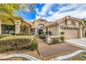 House exterior featuring a walkway and well-manicured landscaping at 3128 Pelican Beach Dr, Las Vegas, NV 89117