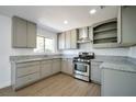 Modern kitchen featuring granite countertops and stainless steel appliances at 3950 Ventura Way, Las Vegas, NV 89121