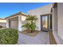 Inviting entryway with landscaping and a modern front door at 4417 S Grand Cypress Way, Pahrump, NV 89061