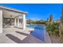 Relaxing pool area with covered patio and comfortable seating at 4417 S Grand Cypress Way, Pahrump, NV 89061