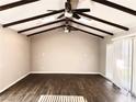 Spacious living area with wood floors, vaulted ceiling, and skylights at 730 Brick Dr, Henderson, NV 89002