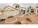 Two-story house with attached garage and landscaped yard at 8424 Oyster Dr, Las Vegas, NV 89128