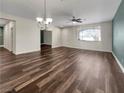 Spacious living room featuring hardwood floors and an accent wall at 866 Austin Peak Ct, Las Vegas, NV 89110