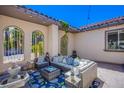 Relaxing outdoor patio with comfortable seating and a fountain at 8965 S Tenaya Way, Las Vegas, NV 89113