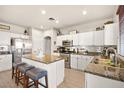 Spacious kitchen featuring granite countertops, stainless steel appliances, and an island at 9124 Ironstone Ave, Las Vegas, NV 89143