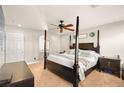 Main bedroom with a large bed, ceiling fan, and ensuite bathroom access at 9124 Ironstone Ave, Las Vegas, NV 89143