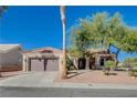 Single-story home with a tile roof and a two-car garage at 10300 Bent Brook Pl, Las Vegas, NV 89134
