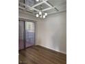 Dining room with mirrored ceiling and hardwood floors at 2112 Venus Ave # A, North Las Vegas, NV 89030
