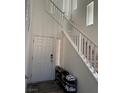 Bright entryway with staircase, door, and shoe rack at 616 Taliput Palm Pl, Henderson, NV 89011