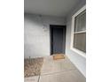 Apartment entry with gray door and stone pathway at 6955 N Durango Dr # 1077, Las Vegas, NV 89149