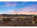 Stunning aerial view showcasing the property's location with city skyline and mountain backdrop at 9605 Verlaine Ct, Las Vegas, NV 89145