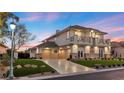 Stunning two-story home with three-car garage, detailed balconies, and a lush, landscaped yard at 9605 Verlaine Ct, Las Vegas, NV 89145