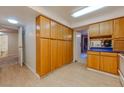 Kitchen with ample wood cabinets and blue countertops at 205 E Harmon Ave # 609, Las Vegas, NV 89169