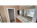 Bathroom with double vanity, soaking tub, and separate shower at 44 Blaven Dr, Henderson, NV 89002