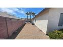Side yard with gravel and privacy wall at 44 Blaven Dr, Henderson, NV 89002
