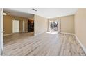 Bright living room with wood-look floors at 5098 River Glen Dr # 220, Las Vegas, NV 89103